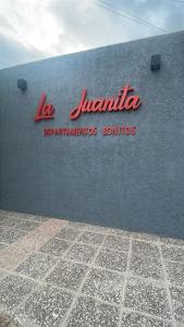 a sign on the side of a building at La Buena Memoria in San Juan
