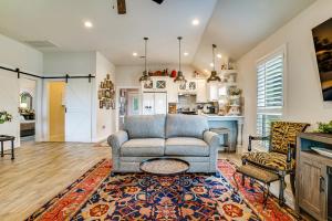 a living room with a couch and a table at Backyard Bungalow w/ Pool & Country Views in Argyle