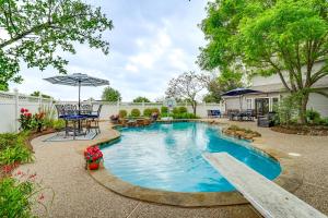 a swimming pool with a table and chairs in a yard at Backyard Bungalow w/ Pool & Country Views in Argyle