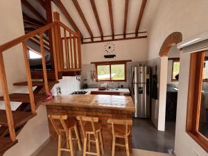 a kitchen with a wooden counter top in a room at Cabaña Villa Serena in Villa de Leyva