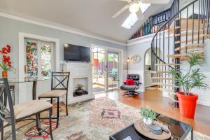 a living room with a spiral staircase and a living room at Walk to Downtown! ABQ Couple's Studio w/ Deck in Albuquerque