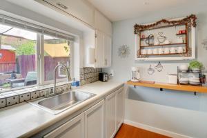 a kitchen with a sink and a window at Walk to Downtown! ABQ Couple's Studio w/ Deck in Albuquerque +18 photos