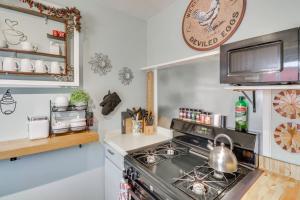 a kitchen with a stove with a tea kettle on it at Walk to Downtown! ABQ Couple's Studio w/ Deck in Albuquerque