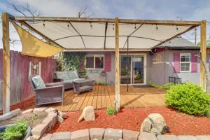a wooden pergola with a chair and a couch at Walk to Downtown! ABQ Couple's Studio w/ Deck in Albuquerque