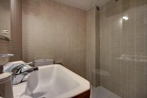 a bathroom with a sink and a toilet and a tub at Casa el Sastre I in Beceite +25 photos