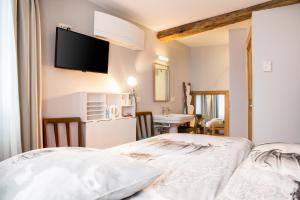 Postel nebo postele na pokoji v ubytování BnB City