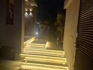 a set of stairs in a room at night at Villa janna in Sukrah