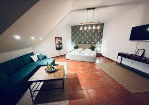 a living room with a couch and a table at Oldenburger Mühle in Oldenburg