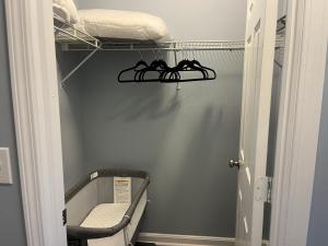 a room with a shelf with shoes on it at Stylish 3BR Townhouse in Radcliff