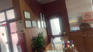 a restaurant with a christmas tree on the wall at Sürücü oteli in Milas