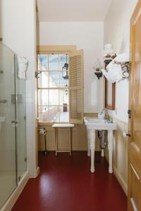 a bathroom with two sinks and a shower at Cosmopolitan Hotel in San Diego +64 photos