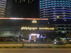 a building with a sign that reads grand ballota at night at Ocean Grace Residence in Batumi