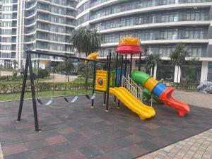 a playground in a city with slides and slidesktop at Ocean Grace Residence in Batumi