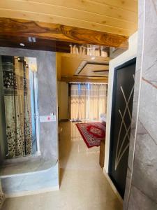 a hallway of a house with a wine cellar at Rivervalley View Homestay in Kandāghāt