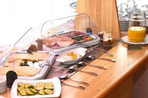 a table with a buffet of food on it at Hotel Dorotheenhof in Cottbus