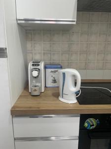 a kitchen counter with some appliances on it at Casa VERA in Pitelli