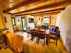 a living room with a table and a couch at Chalet Anita Rogla in Zreče
