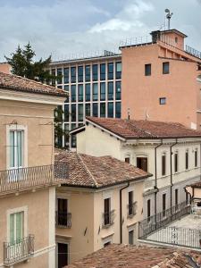 a group of buildings in front of a building at Sirè House in LʼAquila