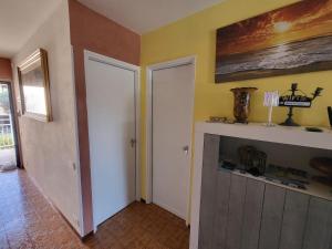 a room with two white doors and a fireplace at Residenza Cornicello in Bardolino