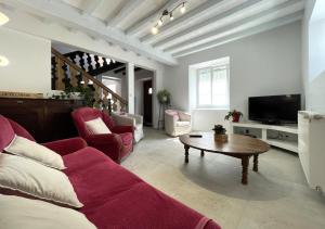 a living room with a couch and a coffee table at Etchechoury in Moncayolle-Larrory-Mendibieu