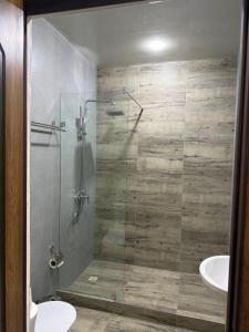 a bathroom with a shower and a toilet and a sink at ART Dream Hotel in Tashkent +19 photos
