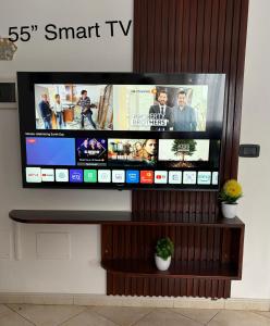 a flat screen tv sitting on top of a wall at Rosa dei venti 3 in Santa Maria
