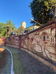 a wall with a mural on the side of it at Cabaña 3 del Puerto Gol in Santo Tomé +5 photos