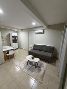 a living room with a couch and a table at Dpto centro CDE in Ciudad del Este +14 photos