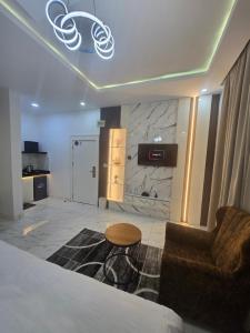 a living room with a couch and a table in a room at TWR Abuja Partner #Blessing in Abuja +23 photos