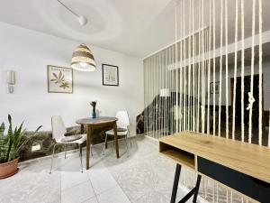a dining room with a table and chairs at BellaVista DM private pool in San Bartolomé