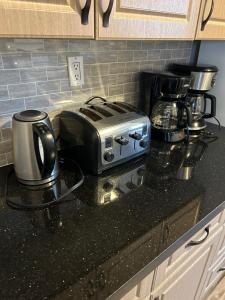 a toaster sitting on a counter in a kitchen at Dougs house in Niagara Falls
