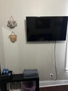 a flat screen tv hanging on a wall at Dougs house in Niagara Falls