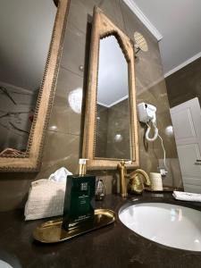 a bathroom with a sink and a mirror at Villa Chamare in Pero +27 photos