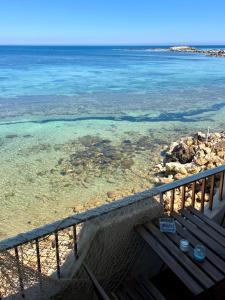 a view of the ocean from a balcony at La terrazza sul mare, 44 in Marzamemi