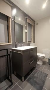 a bathroom with a sink and a toilet at Casajurada in Pinhel +8 photos