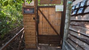 a wooden door on the side of a building at Cabaña Tejon - Casa Corazon Mazunte in Mazunte +8 photos