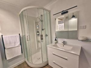 a bathroom with a shower and a sink at 21 Villa in Whangarei +109 photos