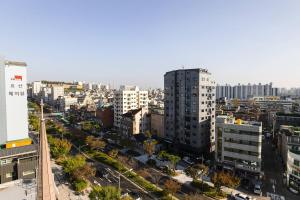 an aerial view of a city with tall buildings at Camp Hotel in Seoul