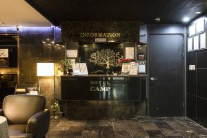 a hotel lobby with a hotel camp sign on the wall at Camp Hotel in Seoul