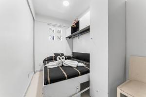 a small room with a bed in the middle at Suites CDMX in Mexico City