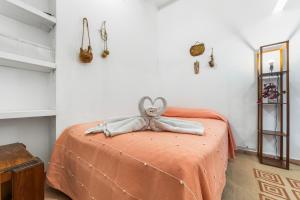 a bedroom with a bed with a stuffed animal on it at Suites CDMX in Mexico City