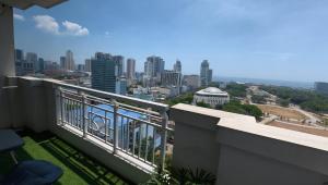 a balcony with a view of a city at Manila Sunset View in Manila