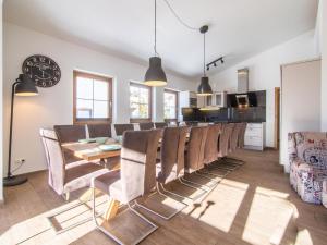 a dining room with a table and chairs at Haus Bergblick in Westendorf
