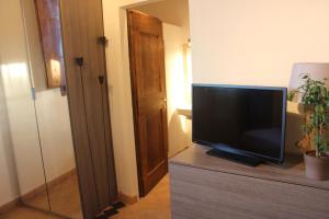 a television sitting on top of a dresser in a room at Da Leo in Montefollonico