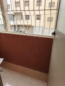 a view of a building through a window at Khouribga in Khouribga