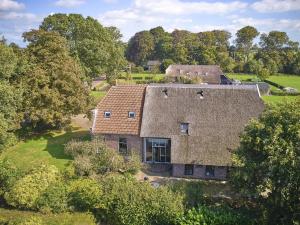 an aerial view of a house with a roof at t Voorhuis Kolderveen in Nijeveen