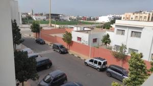 a group of cars parked in a parking lot at Cozy and Comfortable Apartment in Agadir