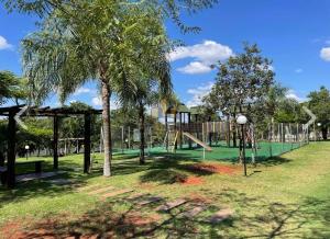 a playground with a slide in a park at Apto Térreo Próximo HU e Aeroporto Vaga e Ar in Londrina