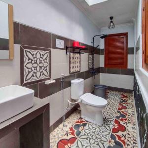 a bathroom with a toilet and a sink at Sabi House Kates in Timuran +27 photos