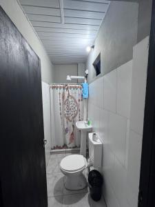 a small bathroom with a toilet and a sink at Colar in Oberá